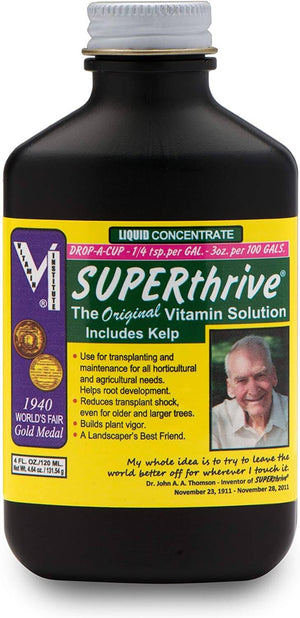 4oz bottle of Superthrive liquid vitamin concentrate with yellow label and inventor portrait.