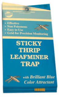 Blue rectangular pest trap package with beige and blue text, grid monitoring feature, and insect illustrations.